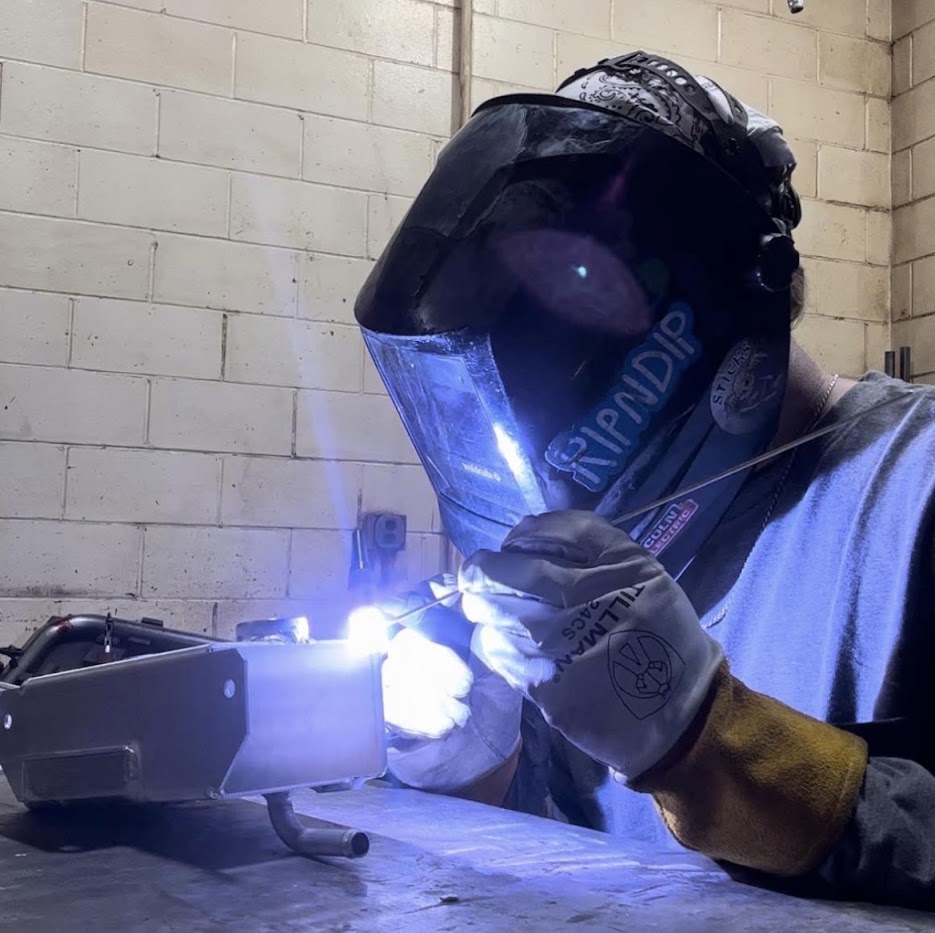 Close-up of TIG welding with bright arc in the shop